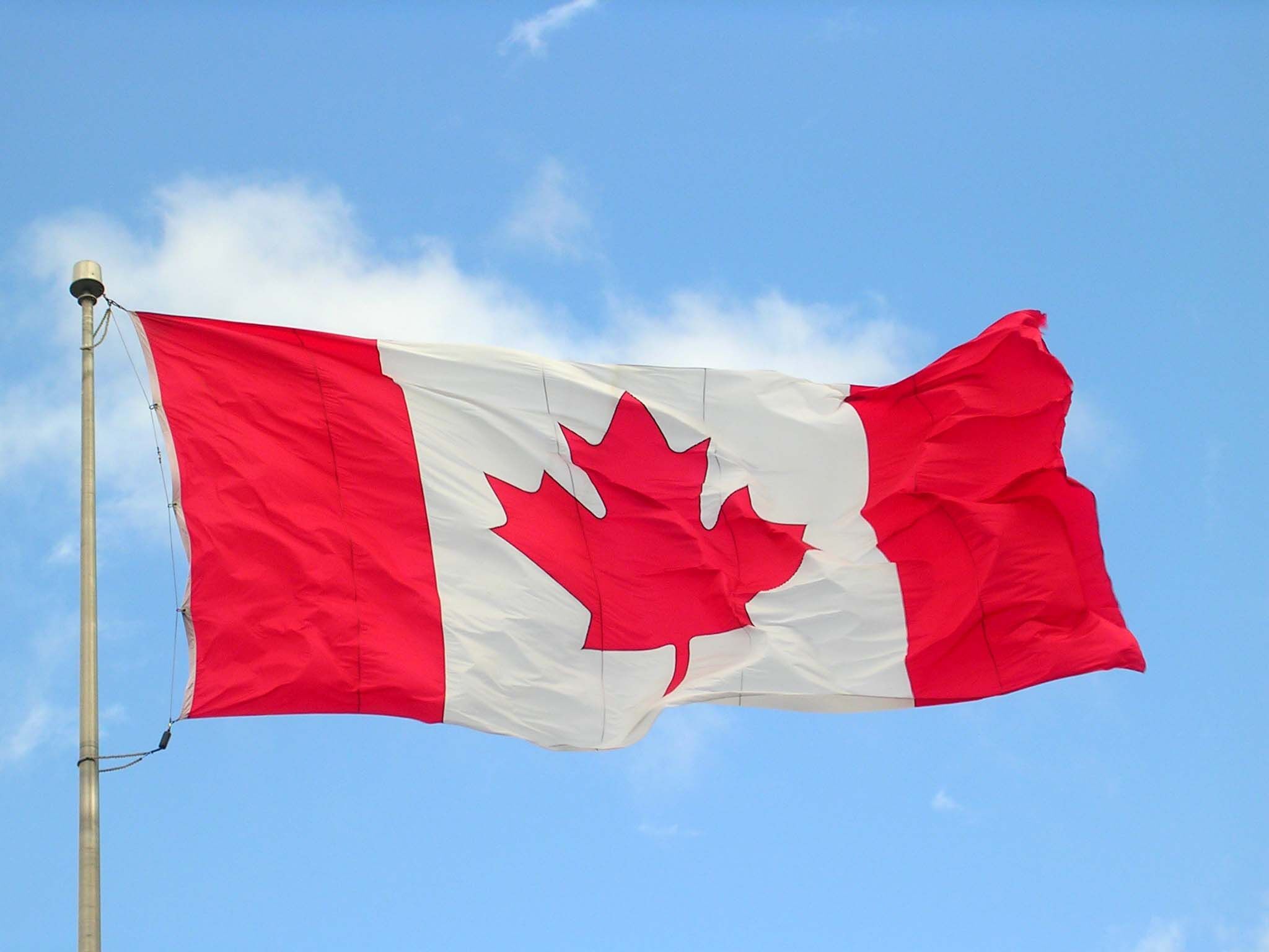 علم كندا - برنامج الهجرة الريفية والشمالية في كندا.